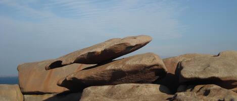 Large boulders stacked in a natural outdoor setting.