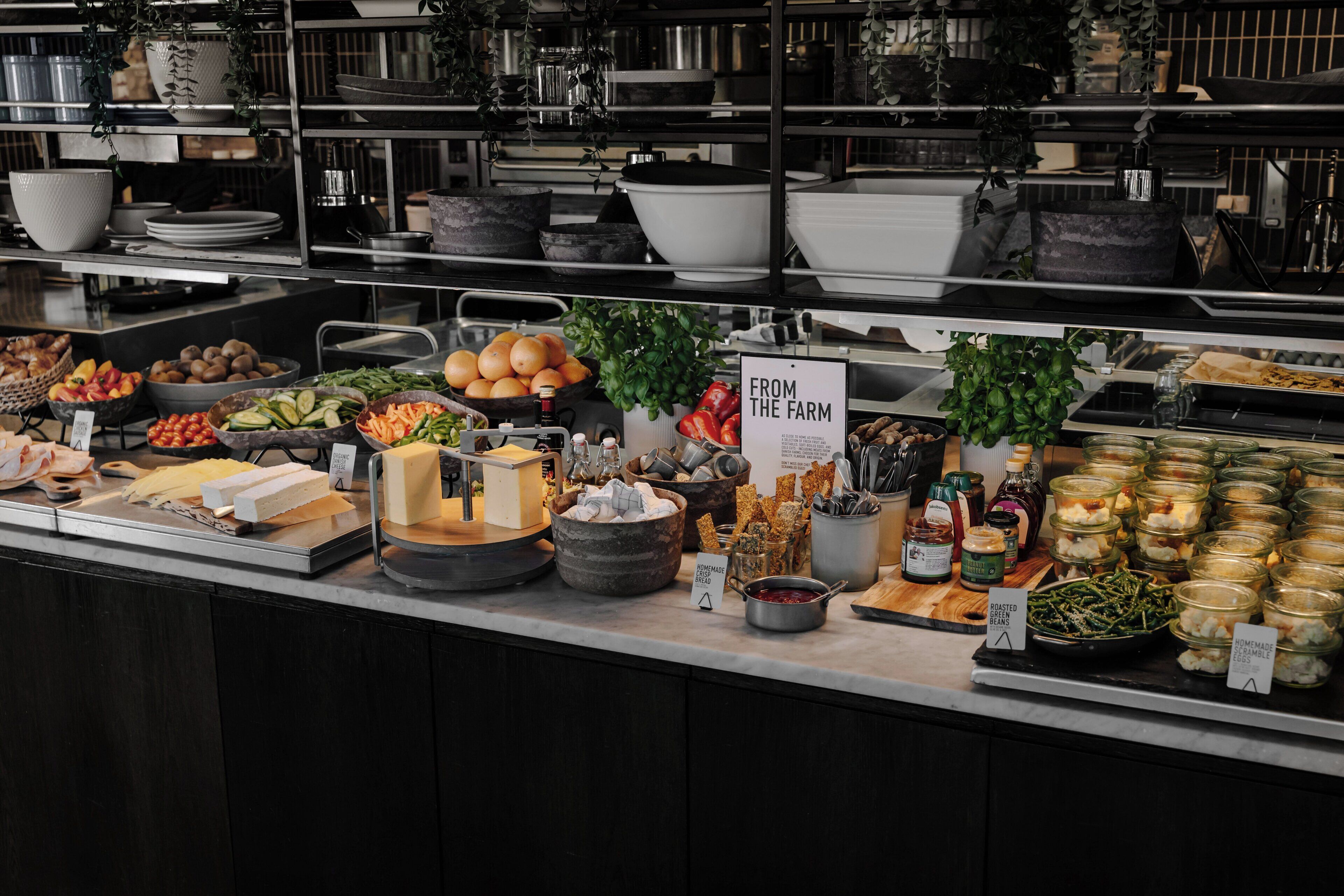 A buffet spread with various food items and condiments.