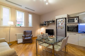 Deluxe Apartment, 1 Bedroom | Living area | 48-inch flat-screen TV with digital channels, TV, Netflix