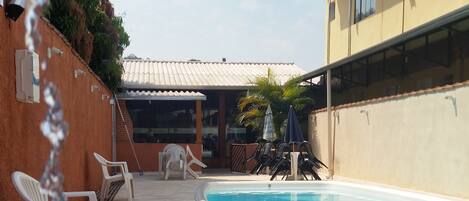 Outdoor pool, pool umbrellas, pool loungers