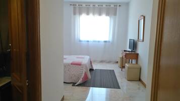 Desk, blackout curtains, free WiFi, bed sheets