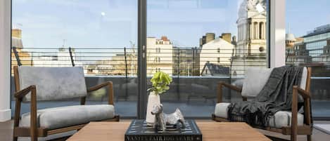 Apartment, 3 Bedrooms | Living room | Flat-screen TV