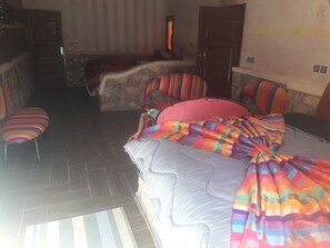 Habitación triple familiar, vista al jardín