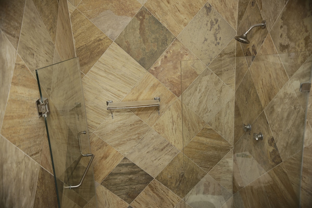 superior room, 1 king bed | bathroom | shower, towels, soap, shampoo