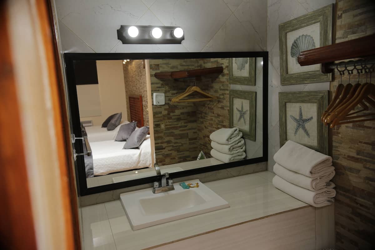 superior room, 2 double beds | bathroom | shower, towels, soap, shampoo