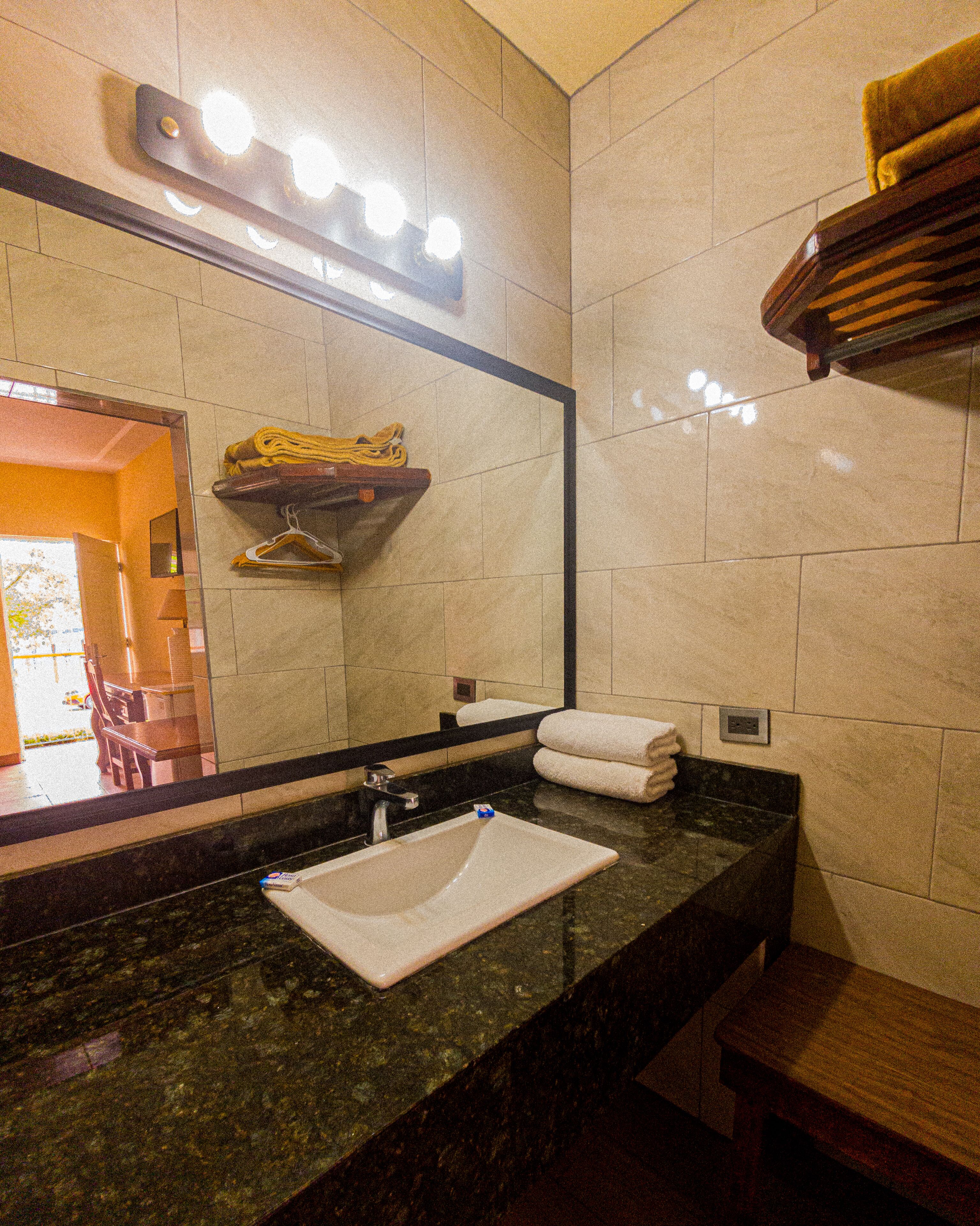 room, 1 queen bed | bathroom | shower, towels, soap, shampoo