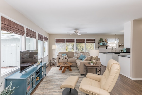 Welcoming and cozy living room overlooking cedar trees in back yard.