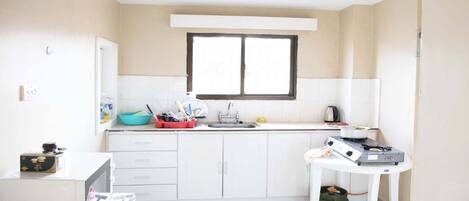Fridge, microwave, stovetop, cookware/dishes/utensils
