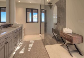 Shower, hair dryer, towels, shampoo