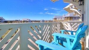 A balcony with a view of houses and a clear sky. - Pet-Friendly Condo w/ Central Location+Resort-Like Amenities@Cinnamon Shore (Port Aransas)