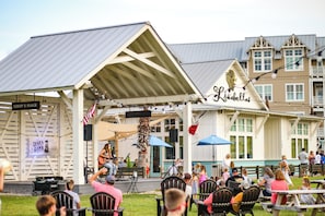 Enjoy live music and socialize with friends at Terry's Place, where tables and chairs are set up for a lively gathering.
