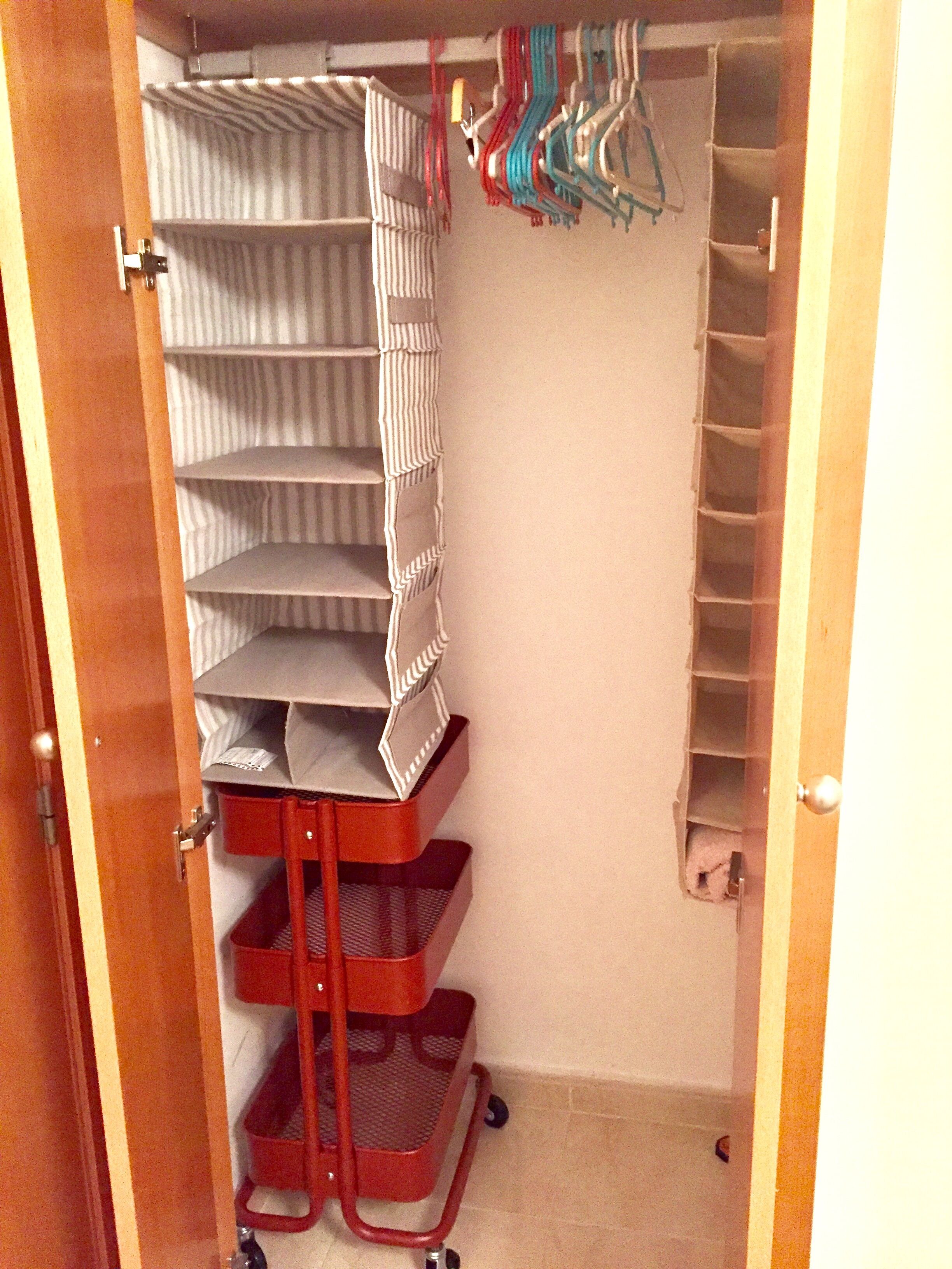 A closet with shelves, hanging space, and a shoe rack.