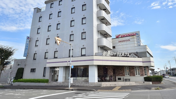 A multi-story building with a Honda Wing sign, indicating a restaurant or dining area on the ground floor. - Suzuka Royal Hotel (Suzuka)