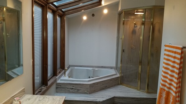 Shower, jetted bath, towels, soap
