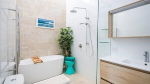 Shower, rainfall showerhead, hair dryer, towels