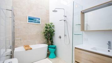 Shower, rainfall showerhead, hair dryer, towels