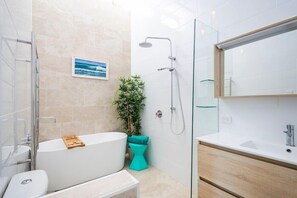Shower, rainfall showerhead, hair dryer, towels