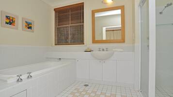 Bathtub, eco-friendly toiletries, hair dryer, soap