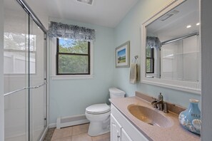 Combined shower/bathtub, hair dryer, towels, toilet paper