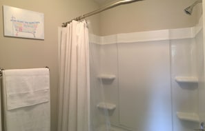 Combined shower/tub, hair dryer, towels, soap
