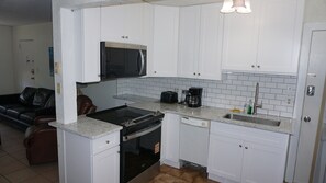 Fridge, microwave, oven, stovetop - GROUND FLOOR ~ Simple 2BR beach-side condo with pool, sleeps 6 ~ FN 601 (St Pete Beach)