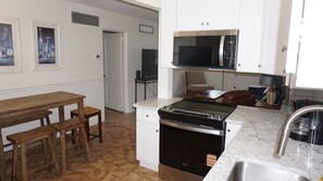 Fridge, microwave, oven, stovetop - GROUND FLOOR ~ Simple 2BR beach-side condo with pool, sleeps 6 ~ FN 601 (St Pete Beach)