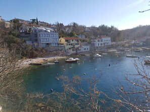 A coastal town with buildings along the waterfront, boats docked in the harbor, and a clear blue sky. - App Sandra 3 bedrooms with 2 bathrooms at 112 m2 on first floor. Rijeka-Kostrena (Kostrena Sveta Lucija)