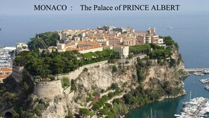 The Palace of Prince Albert in Monaco, featuring a prominent cliffside location with a view of the marina below. - Beautiful for 4 people, town centre, 100 m from the beaches, near the shops (Menton)