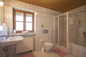 Bathtub, hair dryer, towels