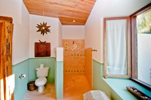Shower, towels, shampoo, toilet paper