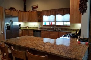 Fridge, coffee/tea maker, cookware/dishes/utensils