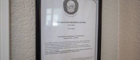 A framed Nevada State Business License certificate.