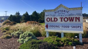 A sign for Historic Old Town with directions to lodging, food, and shops.