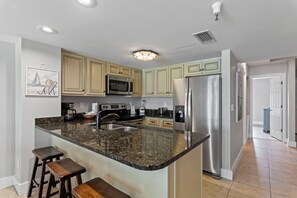 Coffee/tea maker, fridge, microwave, oven