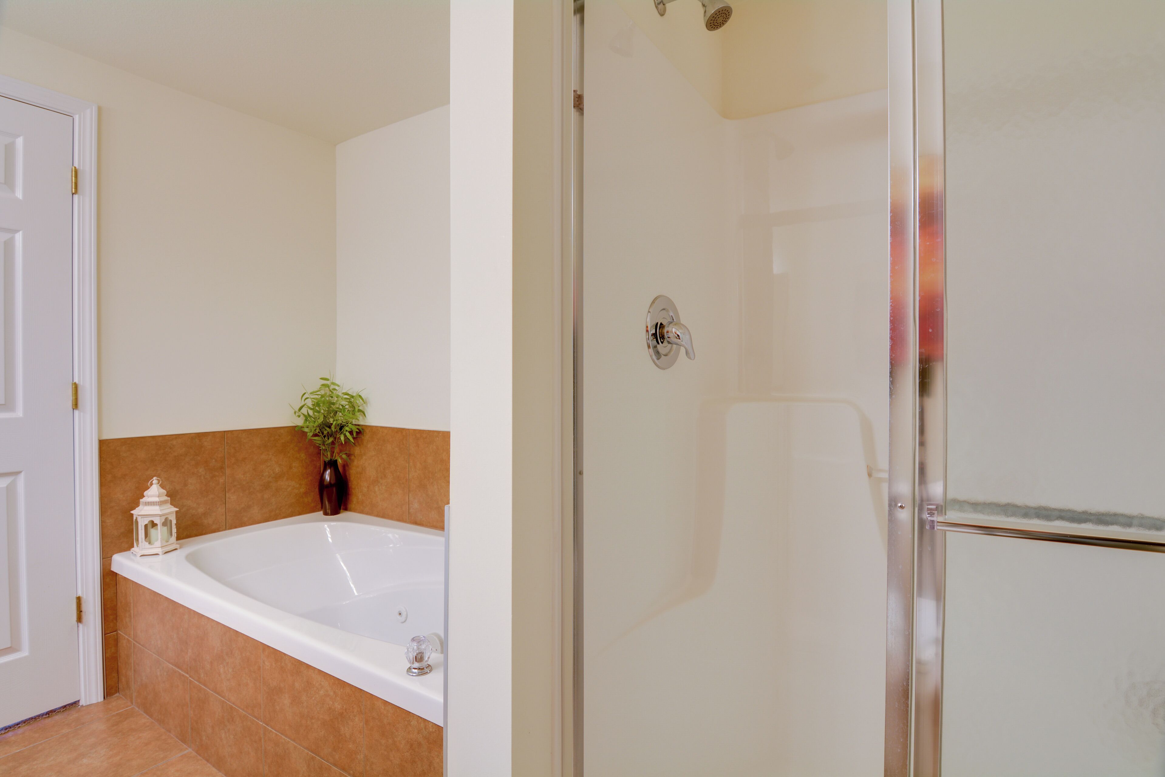 A bathroom with a bathtub, a shower, and a toilet.