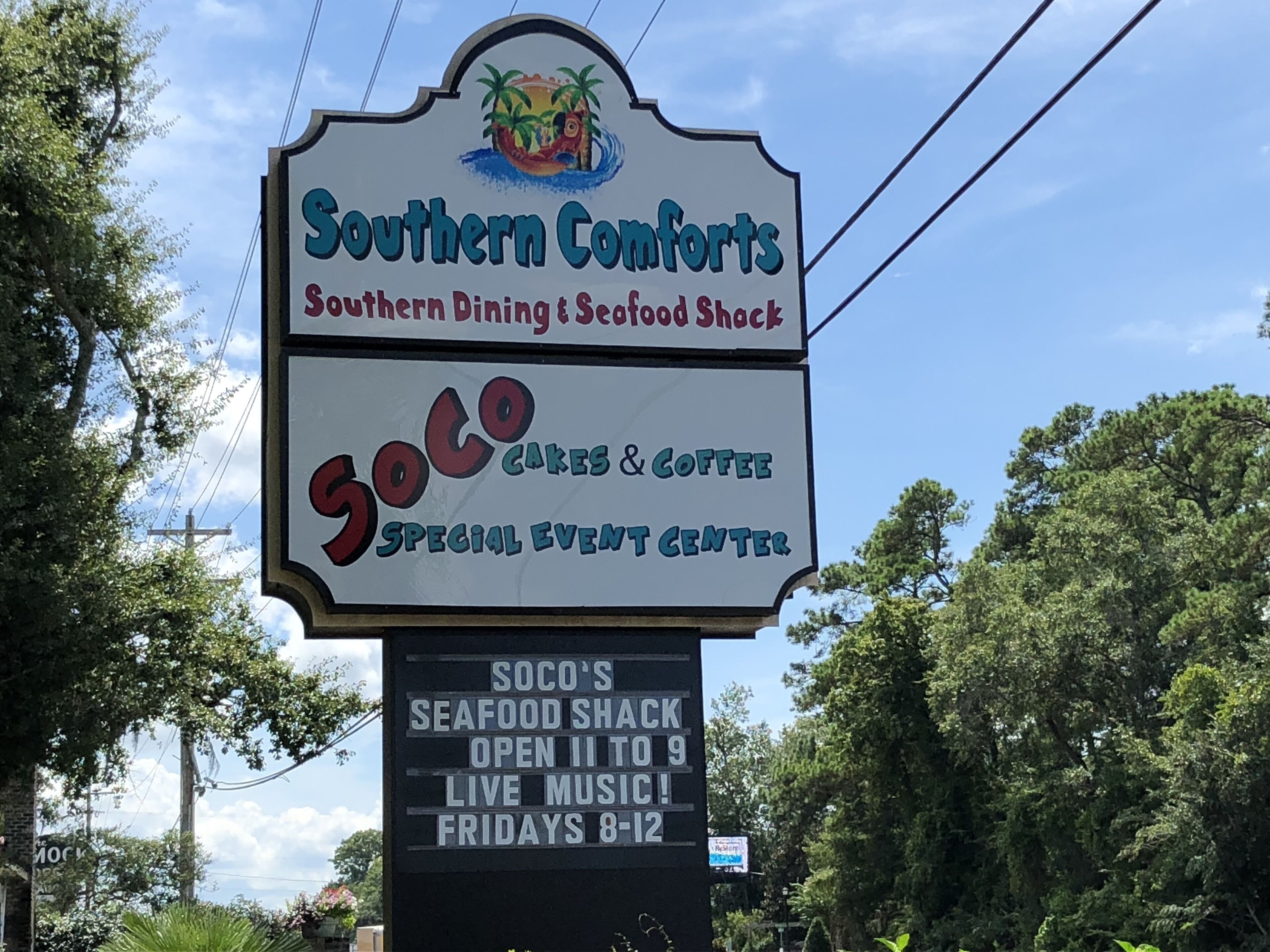 A sign for Southern Comforts, a dining and seafood shack, and Soco Cakes & Coffee, a special event center.