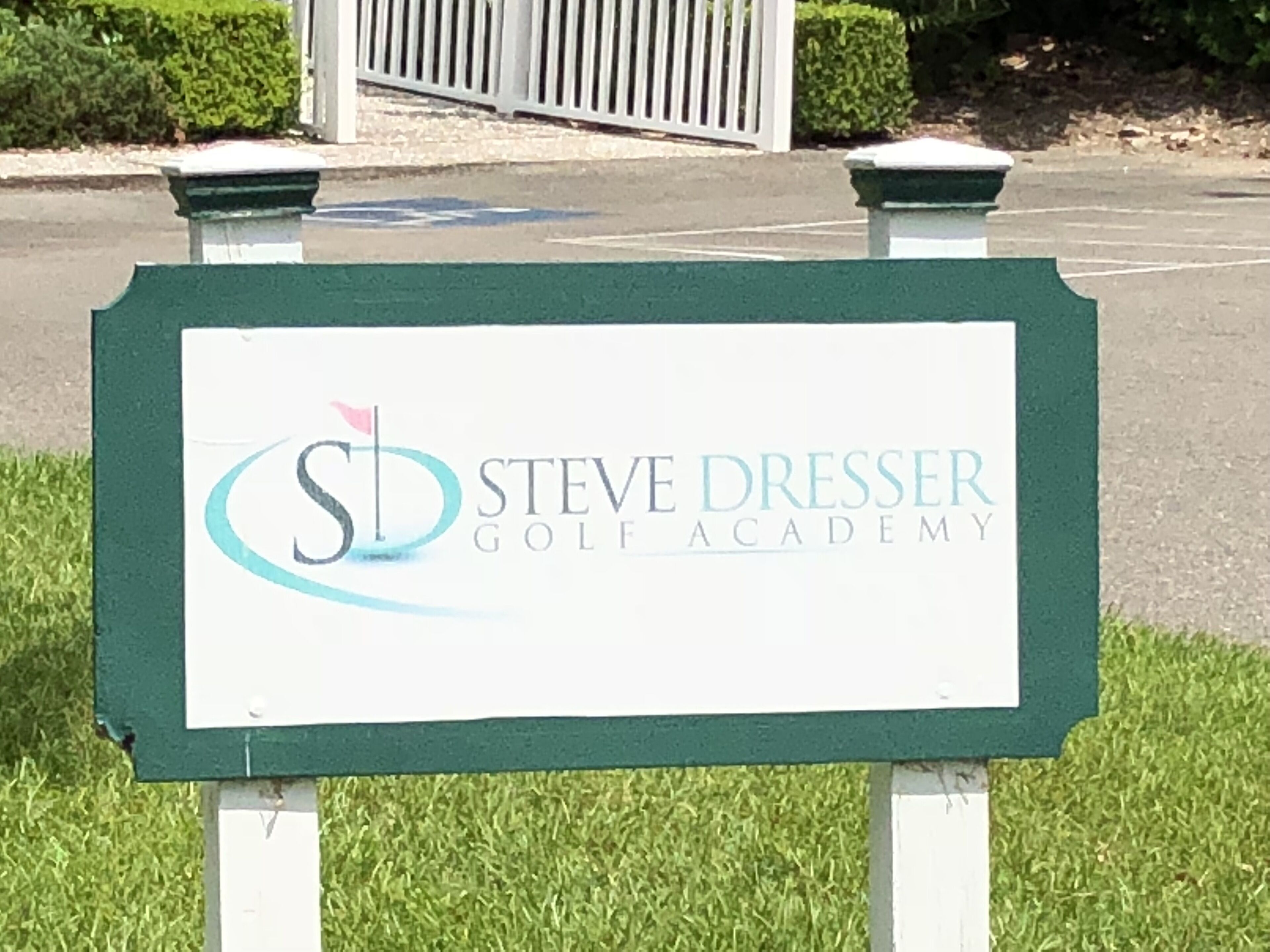 A sign for Steve Dresser Golf Academy.