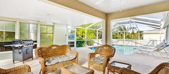 Fenced, private, family friendly villa with exotic poolside views near airport.