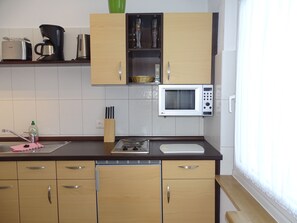 Fridge, coffee/tea maker, electric kettle, toaster