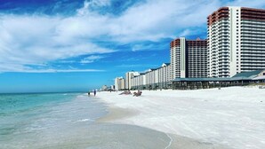A beachfront hotel with multiple high-rise buildings, a sandy beach, and the ocean. - Gulf-Front Corner Unit~Same-Floor Parking~Wrap Balcony~FREE Beach Chairs~Sleep 8 (Panama City Beach)