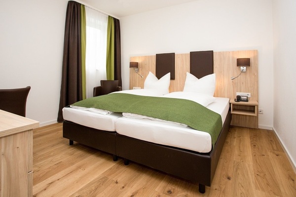 Ferienwohnung 1 mit kostenfreiem WLAN-Zimmeransicht / Schlafbereich Ferienwohnung