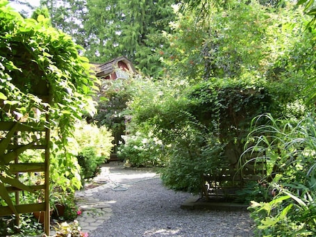 Property grounds. Garden House located on one acre in the heart of the city