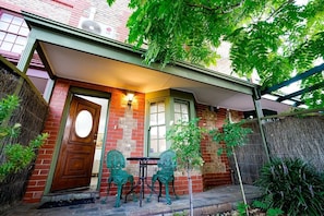 Sit on the porch, enjoy your favorite drink, under the shade of a lovely tree 