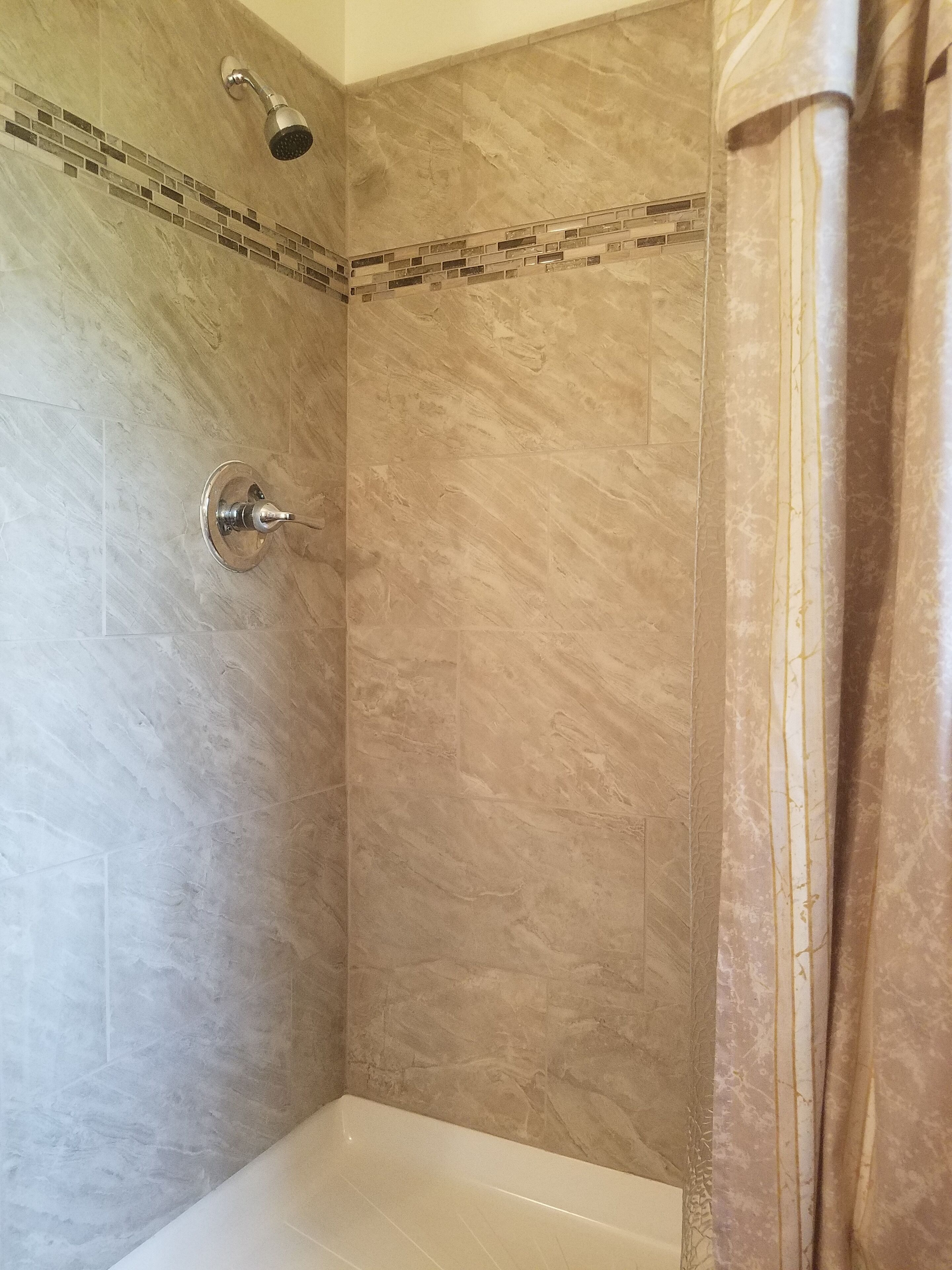 Beautifully tiled easy-entry shower 