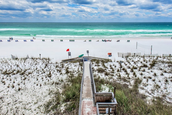 Enjoy the ocean view from the comfort of your beachside retreat, with access to the sandy beach and lifeguard services.