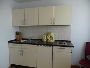 Fridge, coffee/tea maker, electric kettle, toaster