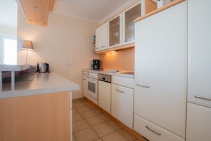 Fridge, oven, dishwasher, dining tables