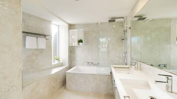 Bathtub, hair dryer, towels, soap
