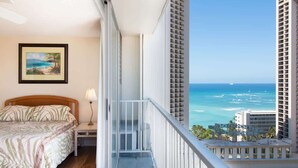 A balcony with a view of the ocean and tall buildings. - Beachside escape w/ ocean view, 22nd floor (Honolulu)