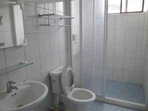 Shower, free toiletries, slippers, towels